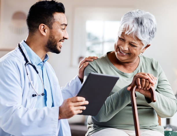 Man providing health services to an elderly woman